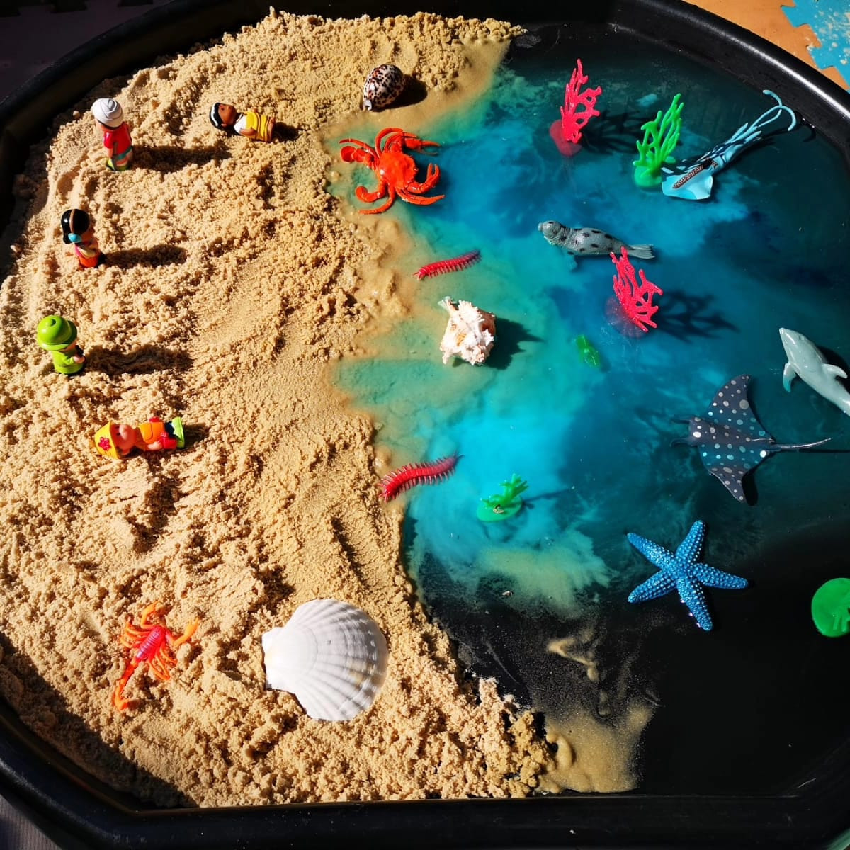 An imaginative ocean-themed sensory play tray